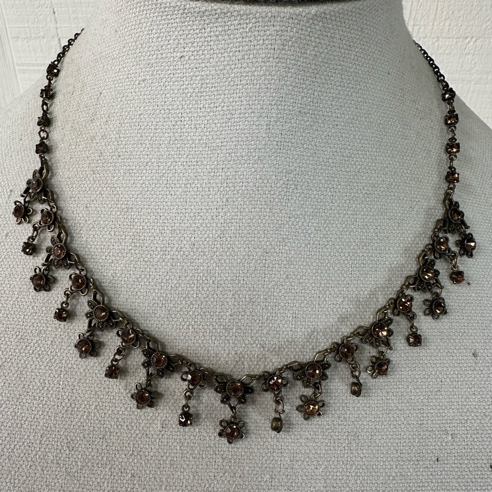 Older feminine drippy golden rhinestone necklace